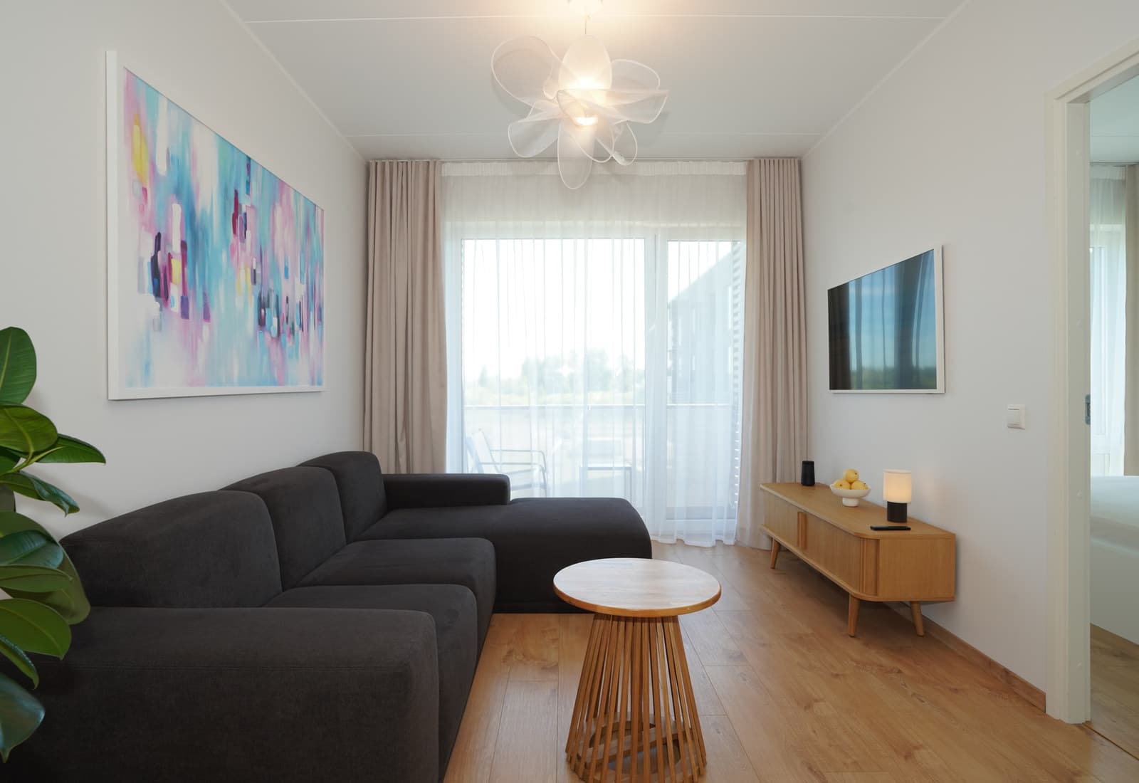 An Aurora Noir living room arranged for a private extended stay